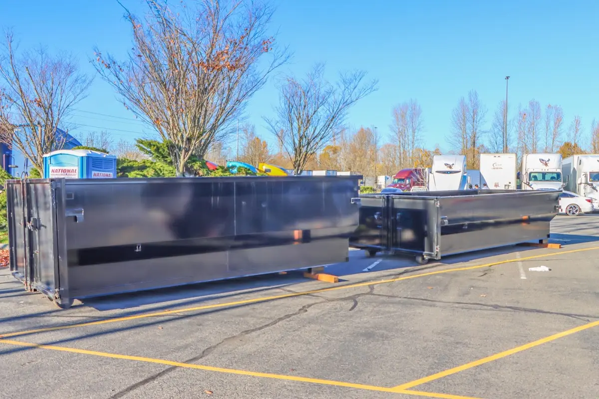 Professional dumpster rental service with roll-off container on residential driveway in Agawam Town